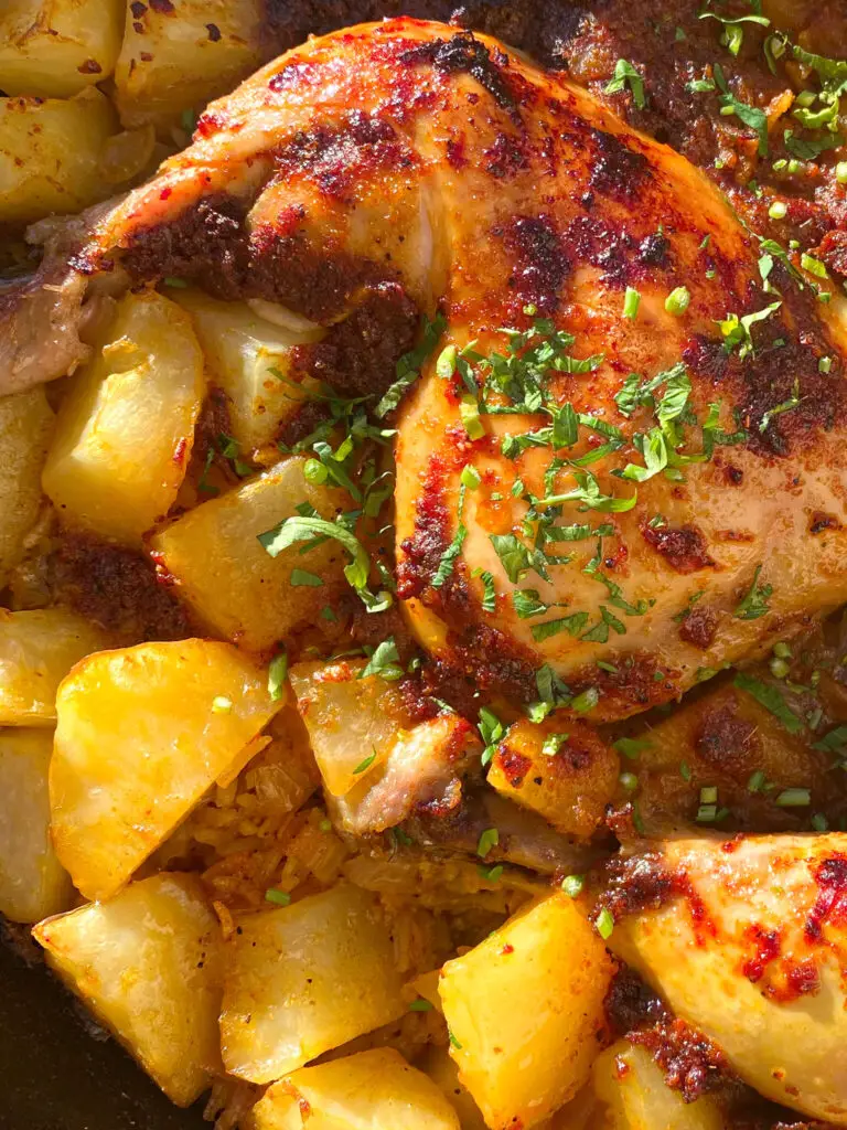 chicken in skillet with potatoes 