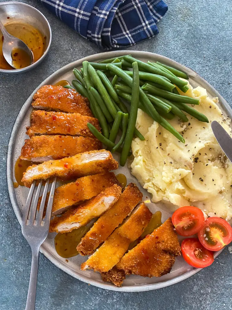 plate of lemon chicken with sides 