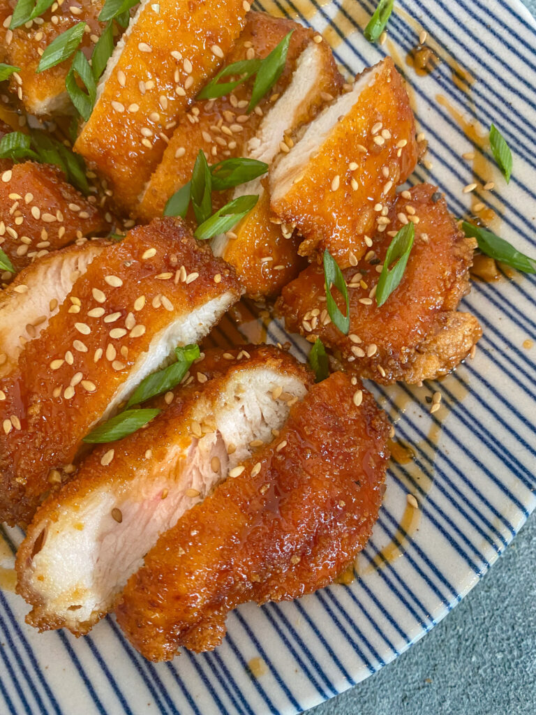 sliced katsu on plate with garnish 