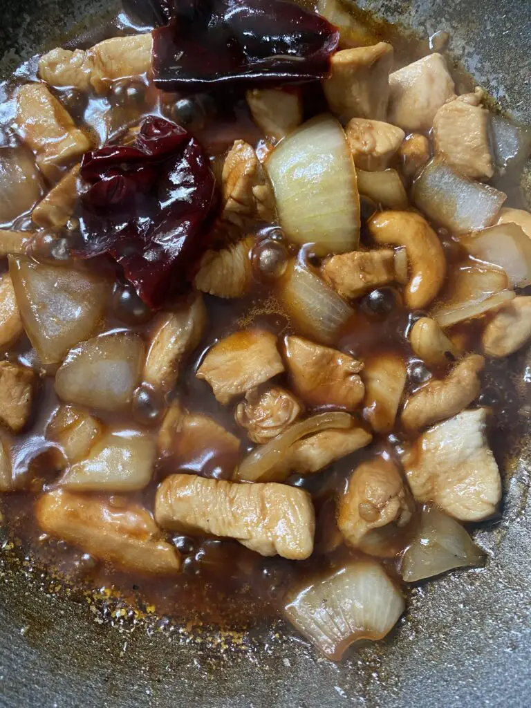 thai cashew nut chicken cooking in sauce 