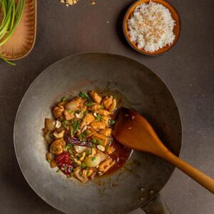 thai cashew nut chicken in wok