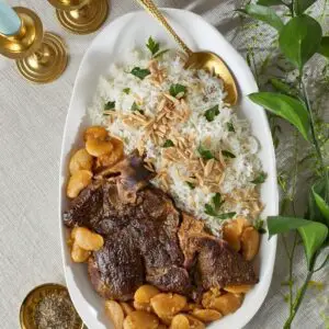 plate of asado with beans and rice