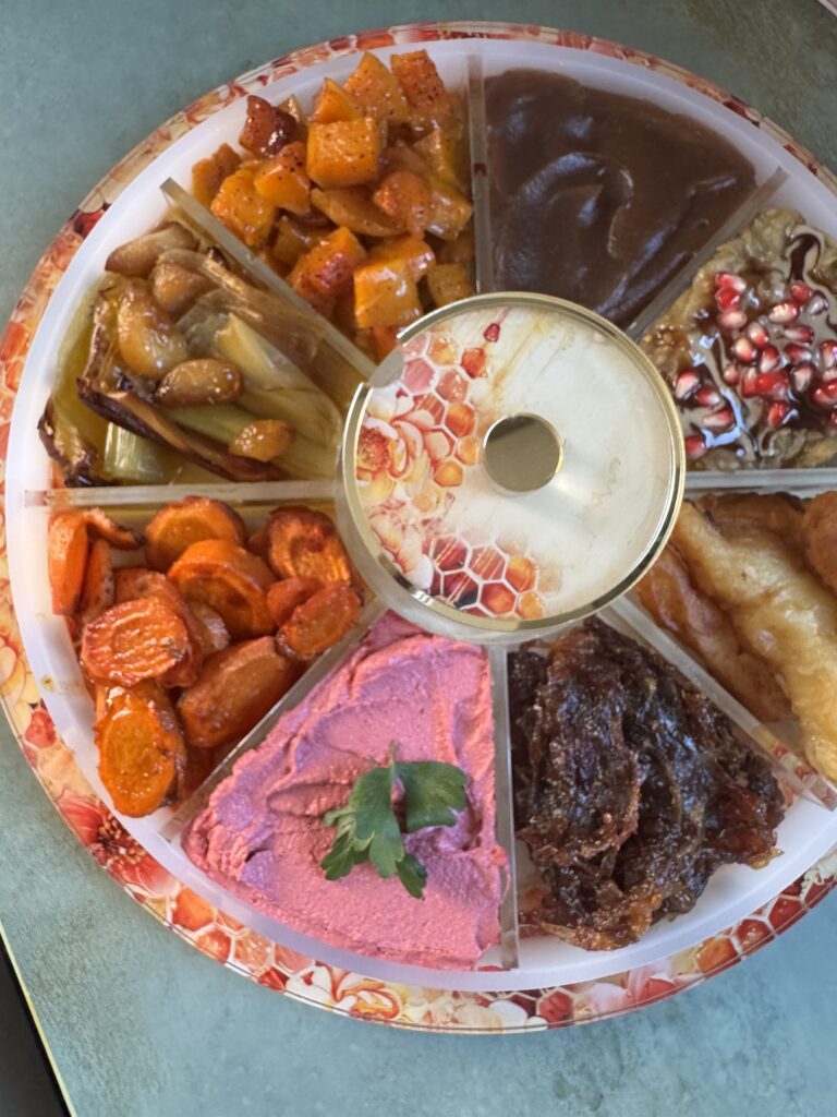 Beautiful Rosh Hashanah tray featuring beet tahini 