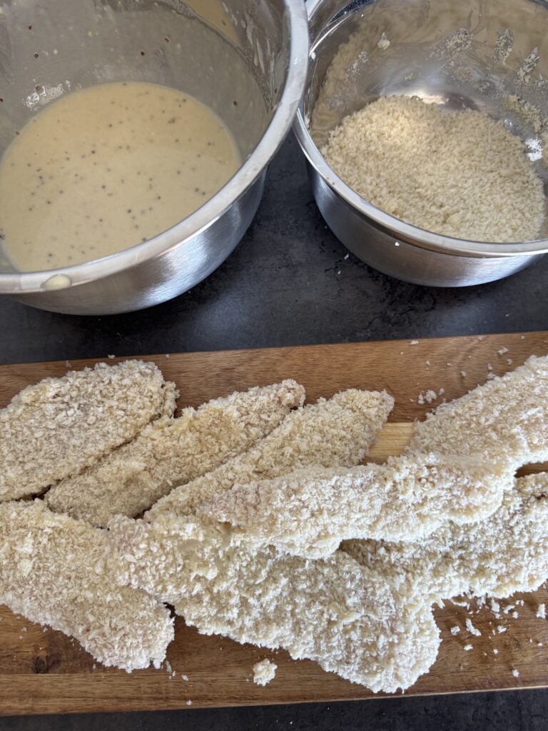 Crispy panko fish fingers breaded and ready to fry 